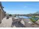 Enjoy sunsets from this patio overlooking a peaceful lake with seating at 16866 S 180Th Ave, Goodyear, AZ 85338