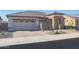 Single story home with tan colored exterior at 16866 S 180Th Ave, Goodyear, AZ 85338