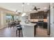 Modern kitchen with dark cabinets and an island at 16866 S 180Th Ave, Goodyear, AZ 85338