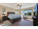 Spacious main bedroom with large windows and water views at 16866 S 180Th Ave, Goodyear, AZ 85338