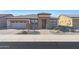 Single-story home with stone accents and desert landscaping at 16866 S 180Th Ave, Goodyear, AZ 85338