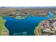 Aerial view of community lake and surrounding homes at 16866 S 180Th Ave, Goodyear, AZ 85338