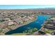 Community overview showcasing lake, homes, and desert landscape at 16866 S 180Th Ave, Goodyear, AZ 85338