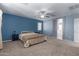 Primary bedroom with ceiling fan and ensuite bathroom at 45226 W Miramar Rd, Maricopa, AZ 85139