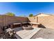 Relaxing patio area with built-in fire pit and seating at 45226 W Miramar Rd, Maricopa, AZ 85139