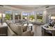 Spacious living room features a fireplace, large windows, and comfortable seating at 9290 E Thompson Peak Pkwy # 493, Scottsdale, AZ 85255
