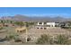 Community entrance with mountain views in background at 2646 E Bluff Spring Ave, Apache Junction, AZ 85119