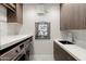 Modern laundry room with washer, dryer and ample counter space at 6525 E Cave Creek Rd # 6, Cave Creek, AZ 85331