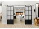 Bright living room with glass-paned barn doors at 6525 E Cave Creek Rd # 6, Cave Creek, AZ 85331