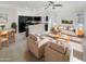 Open concept living room and kitchen with modern appliances and furnishings at 1842 N 77Th Gln, Phoenix, AZ 85035