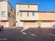Two-story townhome with attached garage and driveway at 1842 N 77Th Gln, Phoenix, AZ 85035
