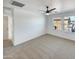 Bright bedroom with two windows and a ceiling fan at 1842 N 77Th Gln, Phoenix, AZ 85035