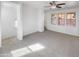Spacious loft area with carpeting and large windows at 1842 N 77Th Gln, Phoenix, AZ 85035