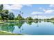 Scenic view of a lake with lush green surroundings at 7955 E Solano Dr, Scottsdale, AZ 85250