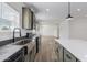 Modern kitchen with stainless steel sink, green cabinets, and a spacious layout at 8066 N Palo Verde Rd, Florence, AZ 85132