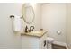 Modern powder room with granite countertop and updated fixtures at 1004 E Tempe Dr, Tempe, AZ 85281