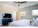 Bright bedroom with a large TV, comfortable bed, and plenty of natural light at 1004 E Tempe Dr, Tempe, AZ 85281