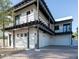 Modern home exterior with a two-car garage and a covered patio at 1004 E Tempe Dr, Tempe, AZ 85281