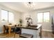 Bright kitchen with an island, stainless steel appliances, and a dining area at 1004 E Tempe Dr, Tempe, AZ 85281