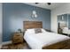 Bedroom with wood bed frame and mirrored closet at 1004 E Tempe Dr, Tempe, AZ 85281