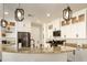 Stylish kitchen boasting granite countertops, white cabinets and a breakfast bar at 1004 E Tempe Dr, Tempe, AZ 85281