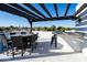 Rooftop deck with pergola, bar, table, and chairs at 1004 E Tempe Dr, Tempe, AZ 85281