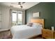 Bedroom with a queen-size bed and private balcony access at 1004 E Tempe Dr, Tempe, AZ 85281