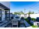 Outdoor patio with seating, fire pit, and artificial turf at 1004 E Tempe Dr, Tempe, AZ 85281