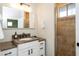 Bathroom with granite countertop and a walk-in shower at 1004 E Tempe Dr, Tempe, AZ 85281