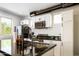 Modern kitchen with stainless steel appliances and dark countertops at 1004 E Tempe Dr, Tempe, AZ 85281