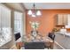 Bright dining area with a marble table and four chairs at 14109 W Horizon Dr, Sun City West, AZ 85375