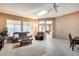 Spacious living room featuring comfortable seating and a view into the kitchen at 14109 W Horizon Dr, Sun City West, AZ 85375