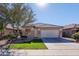 Single-story house with a two-car garage and well-maintained landscaping at 46001 W Tucker Rd, Maricopa, AZ 85139