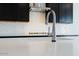 Modern kitchen sink and faucet with a clean and contemporary design at 3636 W Summerside Rd, Laveen, AZ 85339