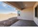 Covered patio and large backyard with block wall at 3636 W Summerside Rd, Laveen, AZ 85339
