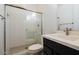 Modern bathroom with a walk-in shower, white subway tile, and dark vanity at 3636 W Summerside Rd, Laveen, AZ 85339
