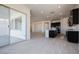 Open kitchen with dark cabinetry, island, and access to patio at 3636 W Summerside Rd, Laveen, AZ 85339