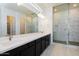 Modern bathroom with marble tile and double vanity at 3636 W Summerside Rd, Laveen, AZ 85339
