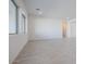 Bright living room with wood-look tile floors and large windows at 3636 W Summerside Rd, Laveen, AZ 85339