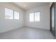 Well-lit bedroom with two windows and wood-look floors at 3636 W Summerside Rd, Laveen, AZ 85339