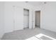 Bedroom with double door closet and access to hallway at 3636 W Summerside Rd, Laveen, AZ 85339