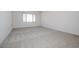 Spacious bedroom with grey carpet and a window at 3636 W Summerside Rd, Laveen, AZ 85339