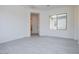 Spacious living room with tile floors and large windows at 3636 W Summerside Rd, Laveen, AZ 85339