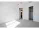 Spacious bedroom with neutral walls, carpet, and access to bathroom and closet at 3636 W Summerside Rd, Laveen, AZ 85339