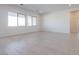 Spacious living area featuring light wood-look tile floors at 3636 W Summerside Rd, Laveen, AZ 85339