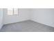Bright bedroom with grey carpet and a window at 3636 W Summerside Rd, Laveen, AZ 85339