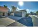 Attached garage with dark gray door at 2416 W Caribbean Ln # 1, Phoenix, AZ 85023