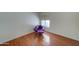 Bright bedroom with hardwood floors and a purple accent chair at 2416 W Caribbean Ln # 1, Phoenix, AZ 85023