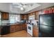 Kitchen with wood cabinets and granite countertops at 2416 W Caribbean Ln # 1, Phoenix, AZ 85023