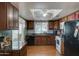 Kitchen with wood cabinets and granite countertops at 2416 W Caribbean Ln # 1, Phoenix, AZ 85023